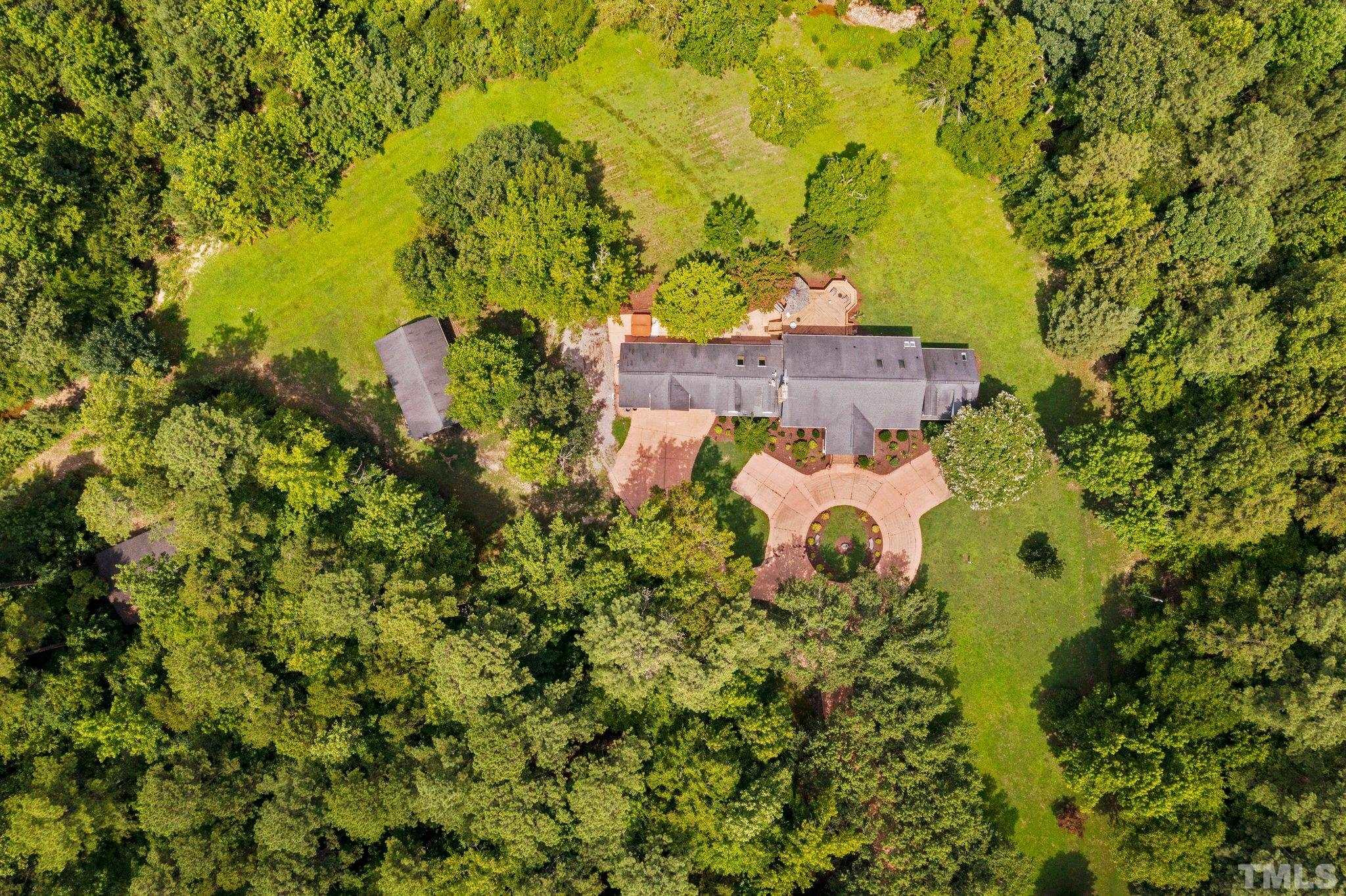 7525 South Tanglewild Drive Raleigh, NC 27613 - Photo 48 of 50 an aerial view of a residential houses with yard