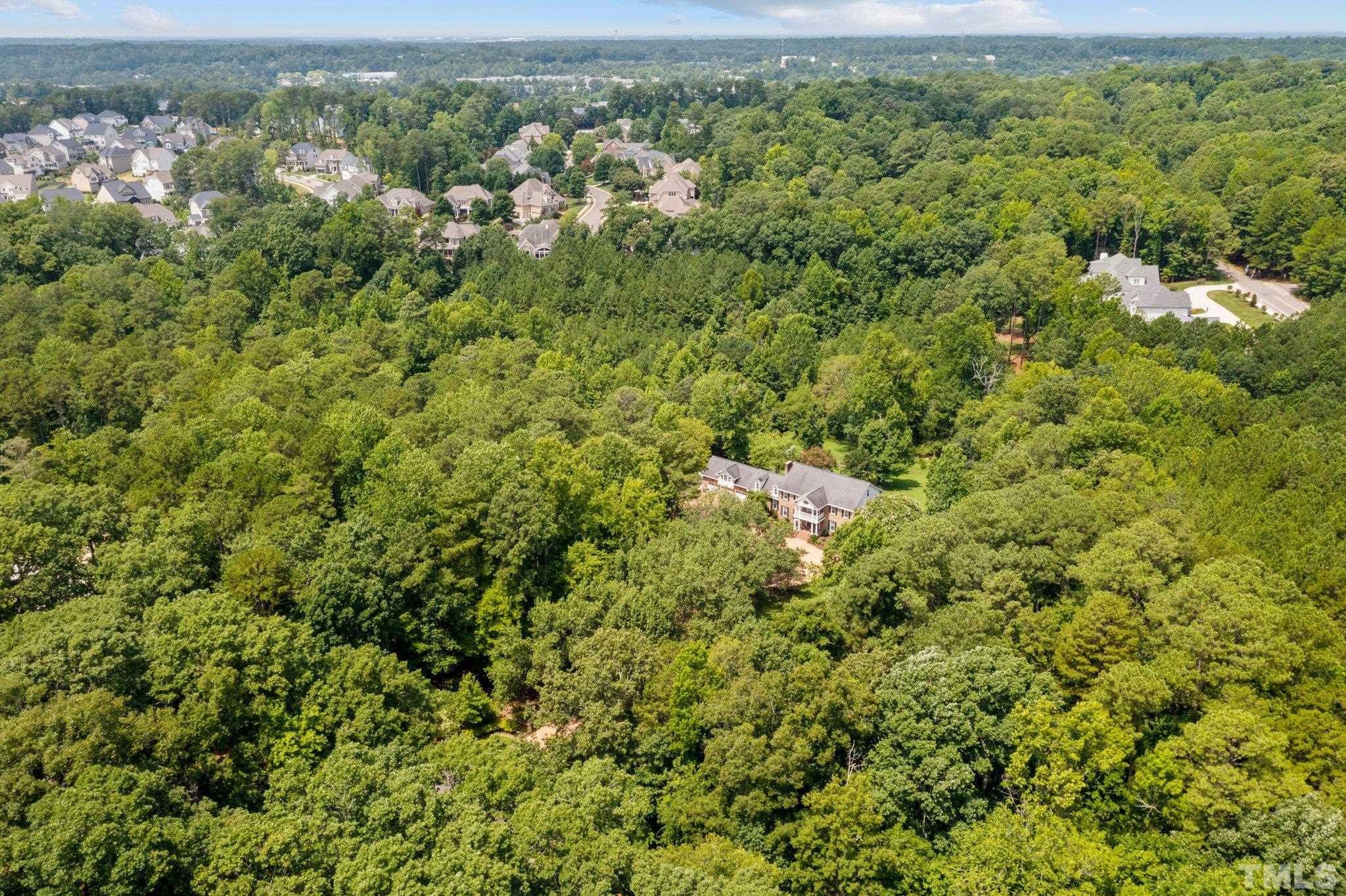 7525 South Tanglewild Drive Raleigh, NC 27613 - Photo 49 of 50 an aerial view of a houses with a yard