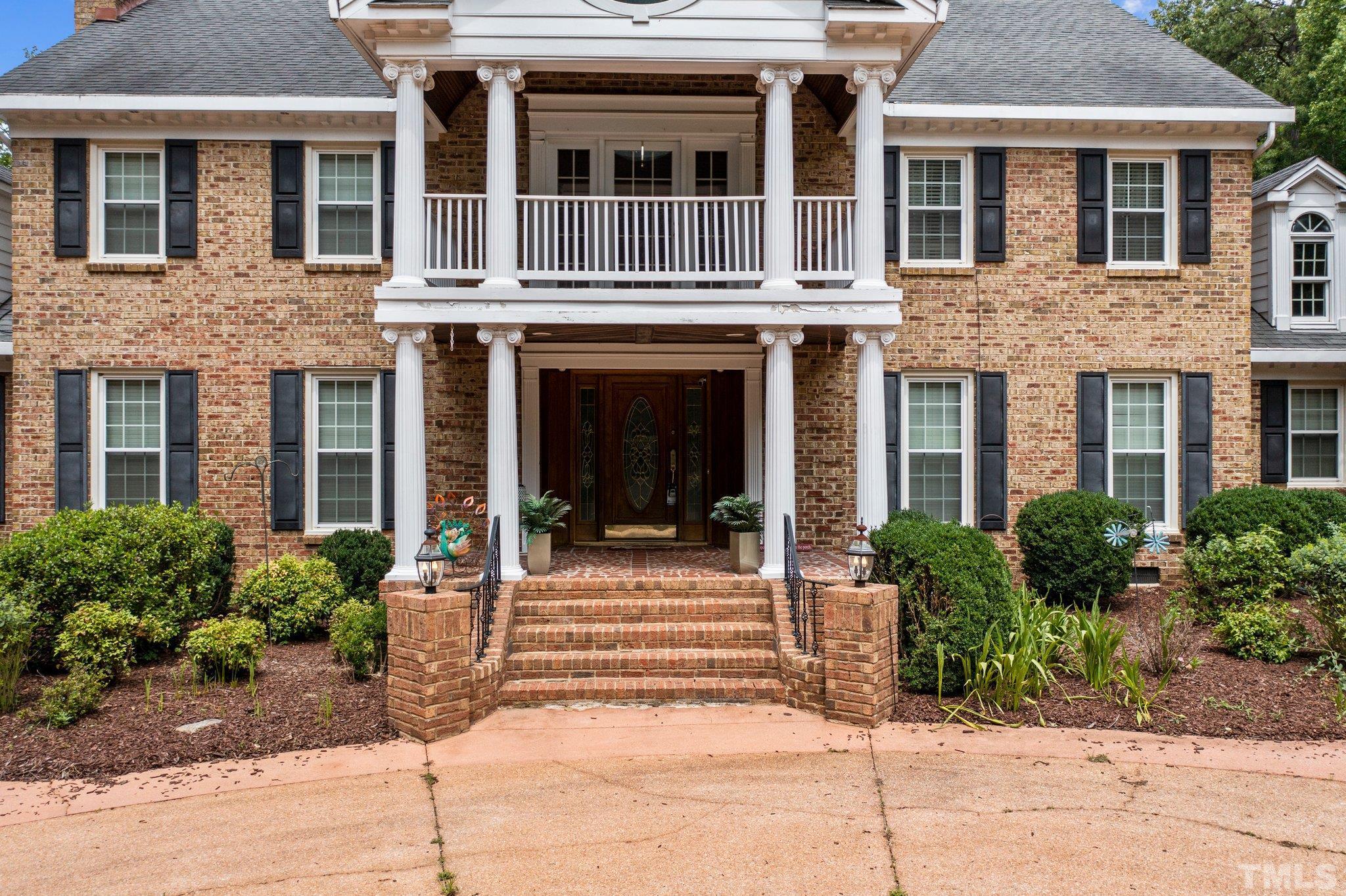 7525 South Tanglewild Drive Raleigh, NC 27613 - Photo 5 of 50 a view of a brick building with many windows