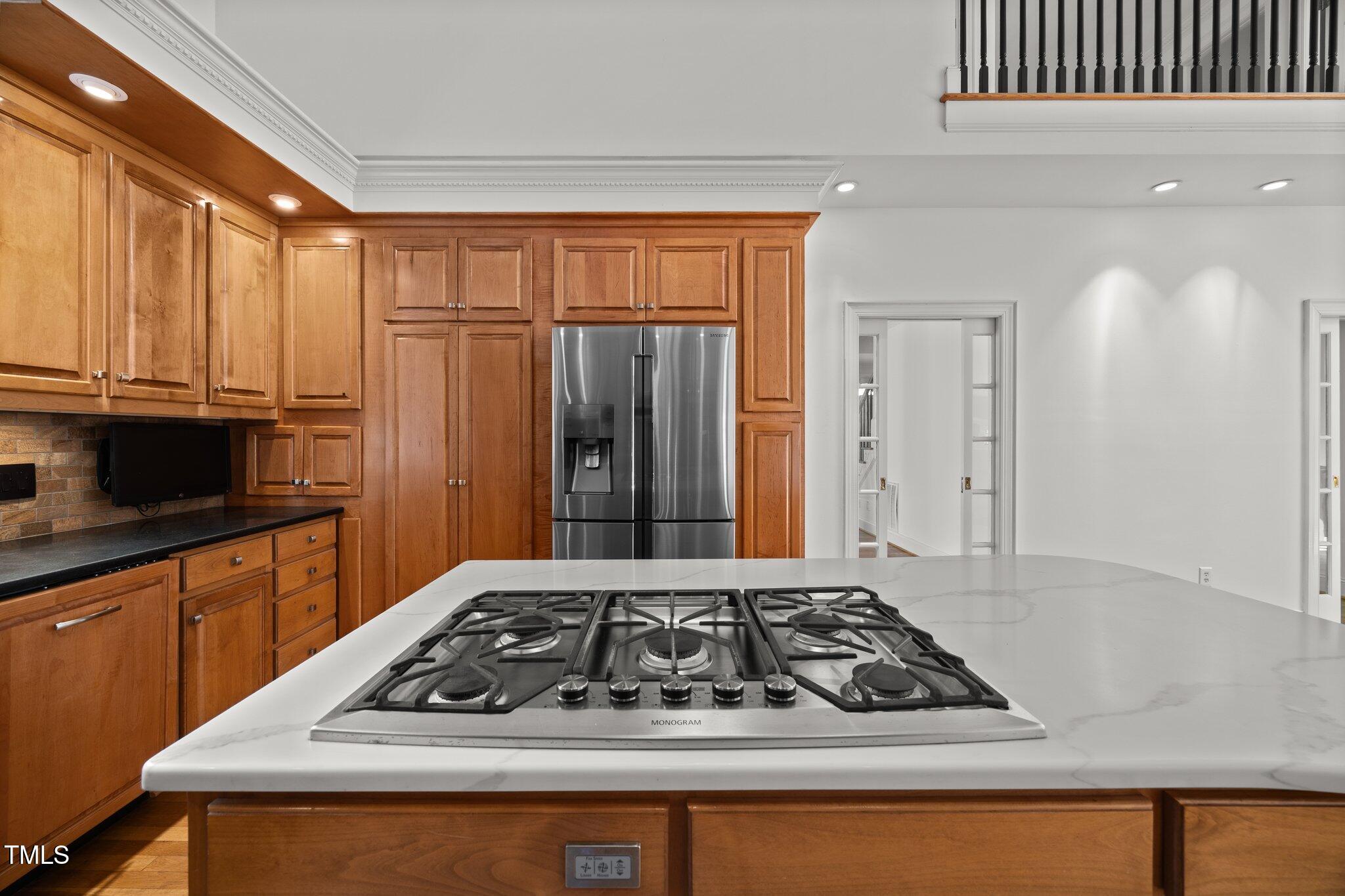 3604 Eden Croft Drive Raleigh, NC 27612 - Photo 17 of 49 a view of a stove and microwave in a kitchen