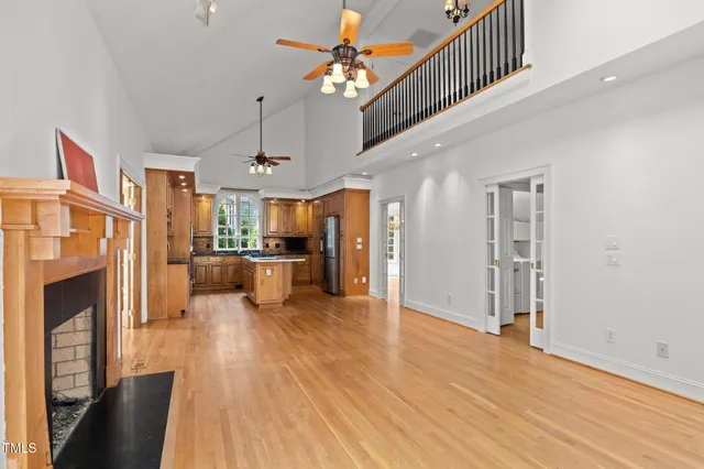 a view of a living room kitchen with furniture and a fireplace