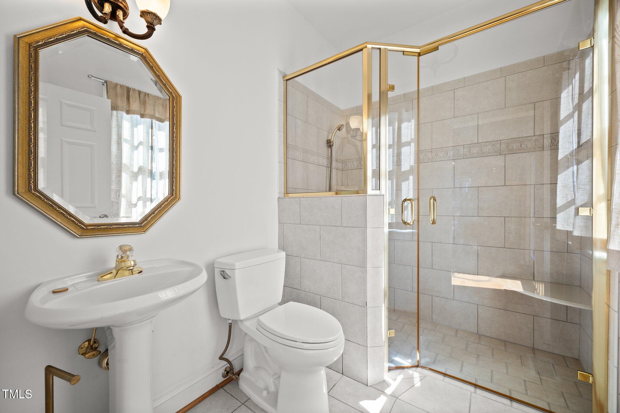 3604 Eden Croft Drive Raleigh, NC 27612 - Photo 23 of 49 a bathroom with a sink toilet and shower