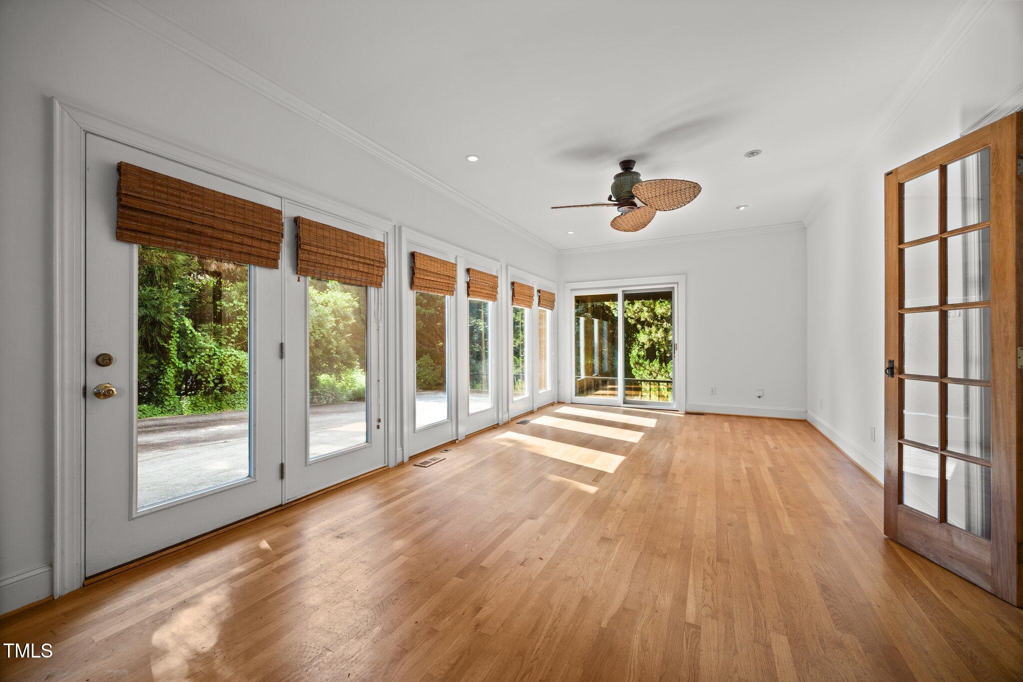 3604 Eden Croft Drive Raleigh, NC 27612 - Photo 24 of 49 a view of an empty room with a window and wooden floor