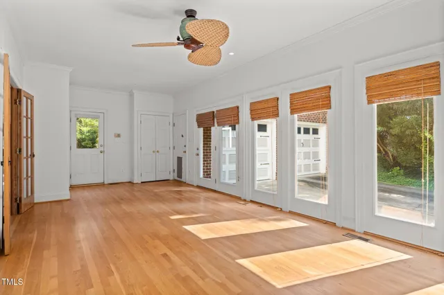 a view of an empty room with windows