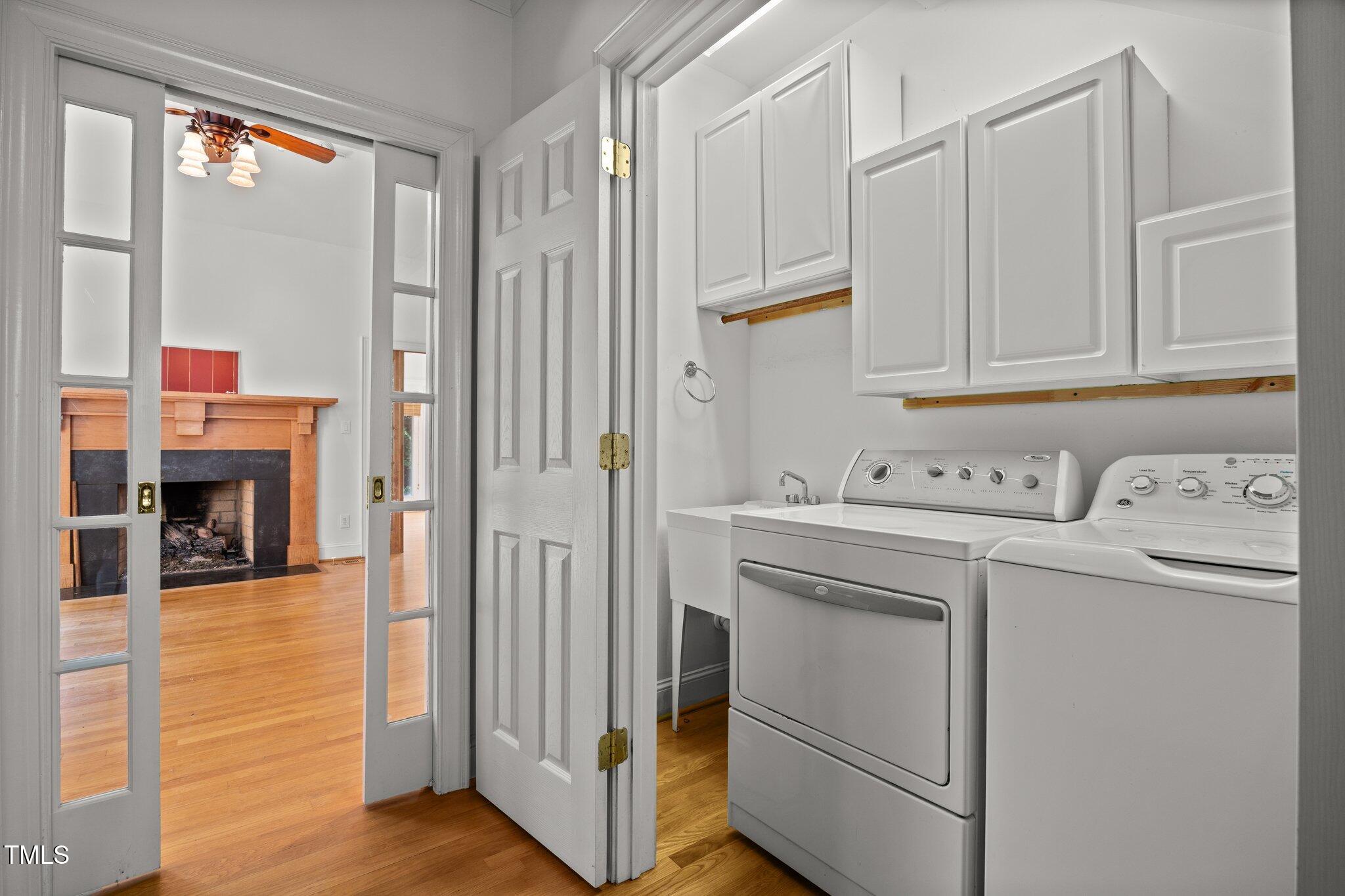 3604 Eden Croft Drive Raleigh, NC 27612 - Photo 27 of 49 a view of cabinets with washer and dryer