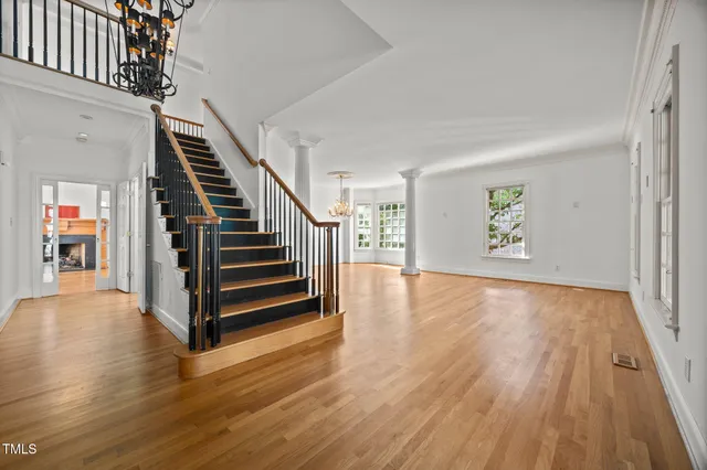 a view of an entryway with wooden floor