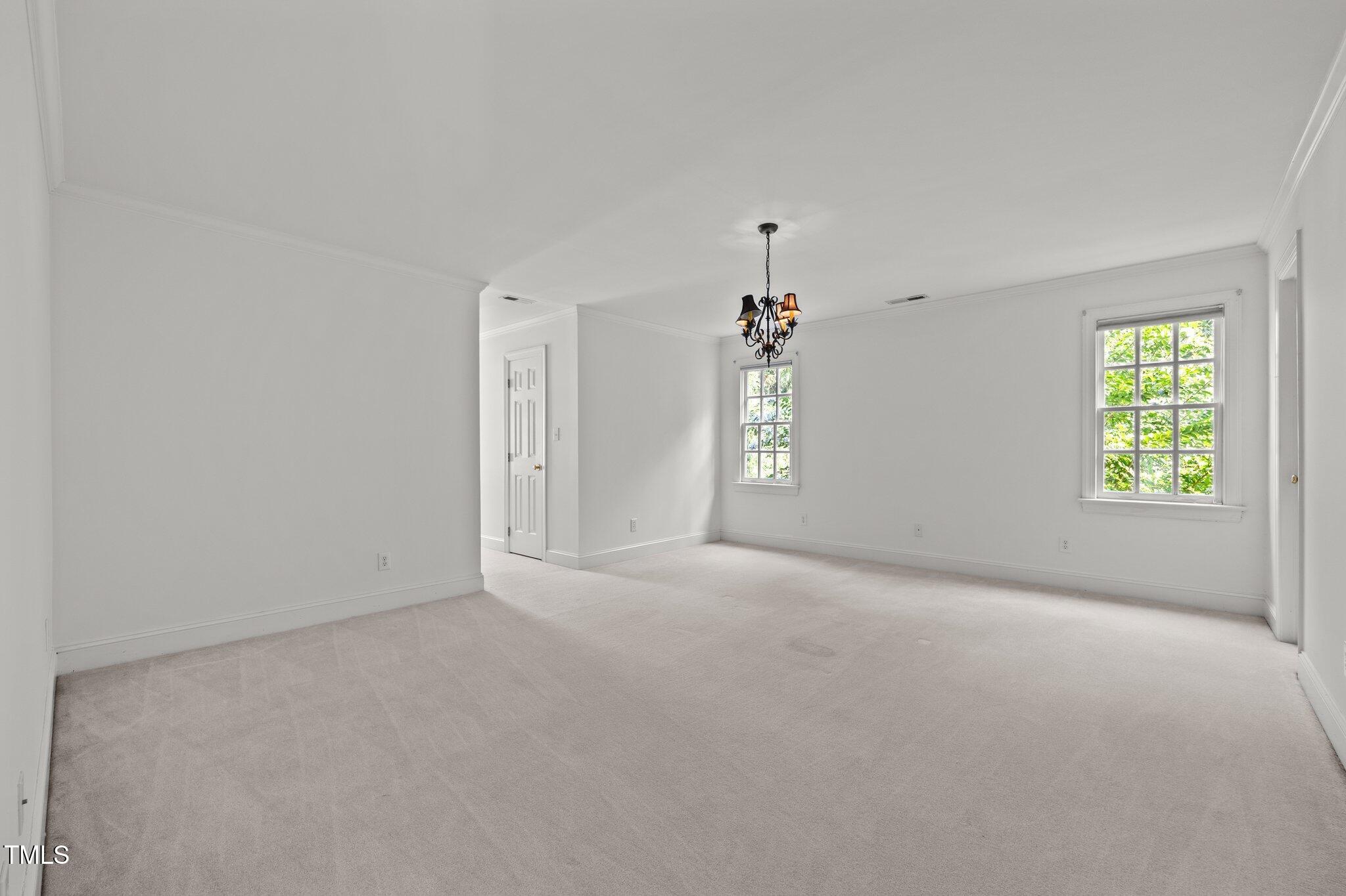 3604 Eden Croft Drive Raleigh, NC 27612 - Photo 37 of 49 an empty room with windows