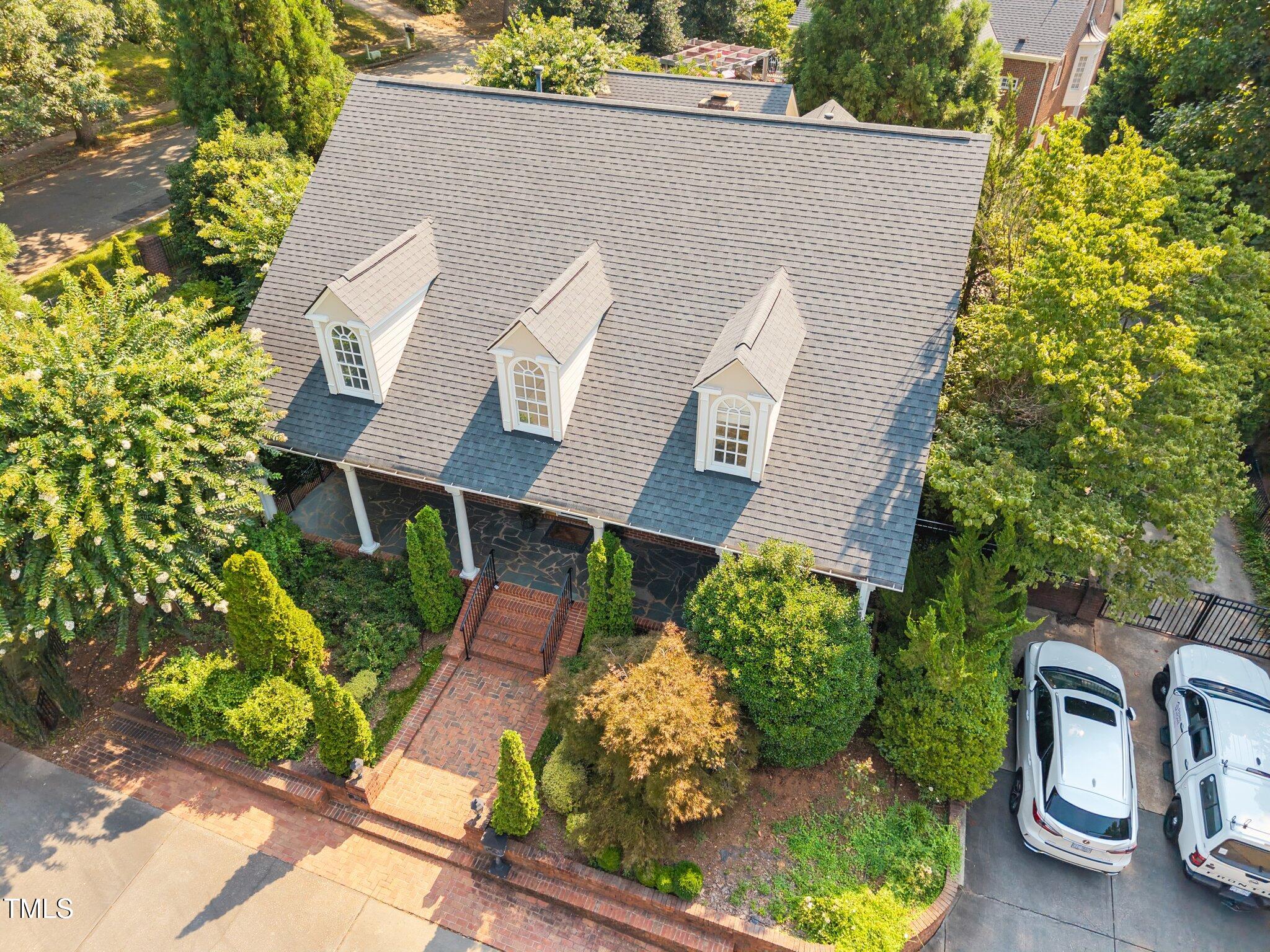 3604 Eden Croft Drive Raleigh, NC 27612 - Photo 46 of 49 a aerial view of a house with a yard and potted plants