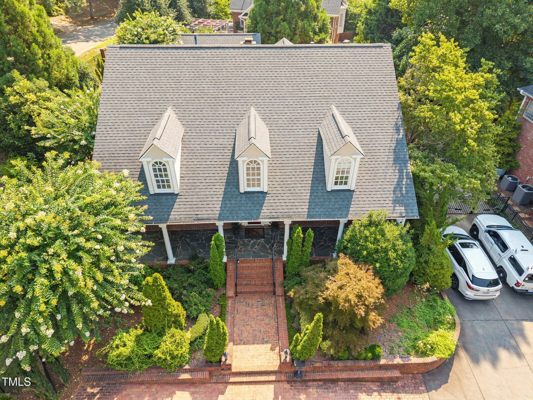 3604 Eden Croft Drive Raleigh, NC 27612 - Photo 47 of 49 a front view of a house with garden
