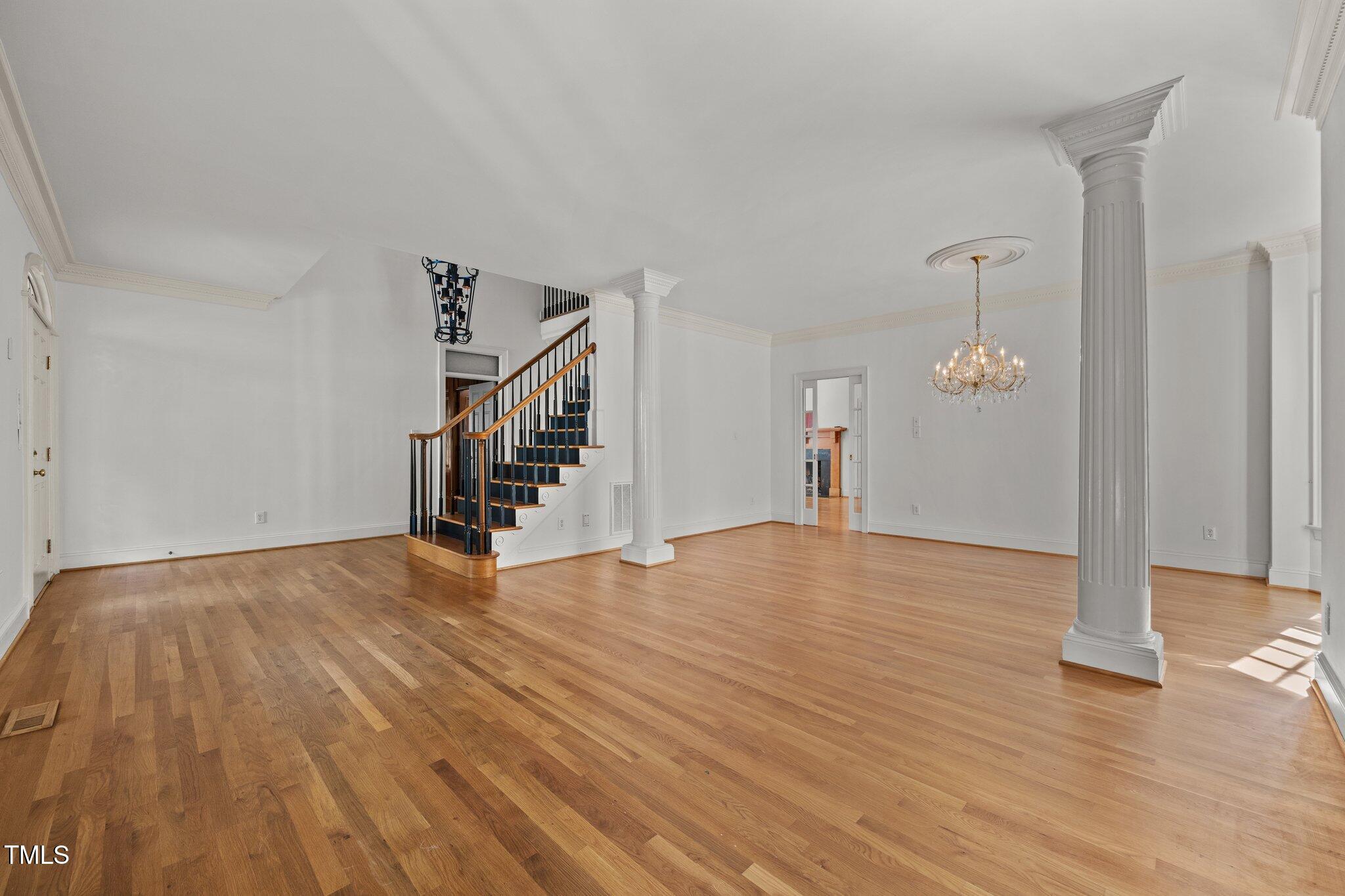 3604 Eden Croft Drive Raleigh, NC 27612 - Photo 6 of 49 a view of empty room with wooden floor