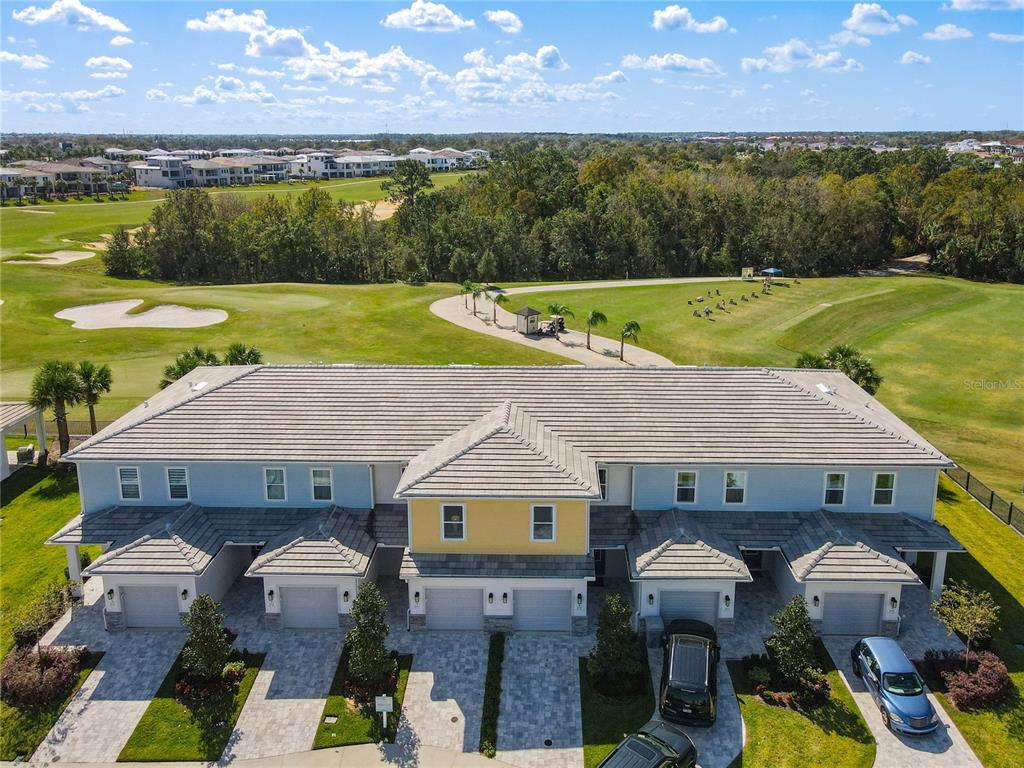 856 Driving Range Court Reunion, FL 34747 - Photo 1 of 1 an aerial view of a house with a yard and a large pool
