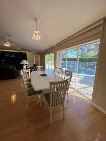 a view of a dining room with furniture window and outside view