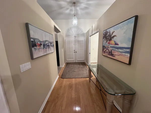 a view of gallery with wooden floor