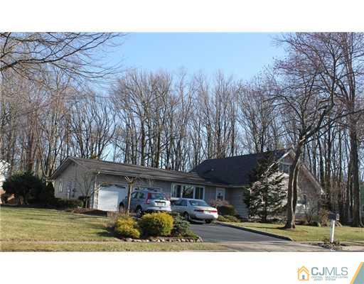 36 Huntington Road Edison, NJ 08820 - Photo 1 of 19 a front view of a house with a yard