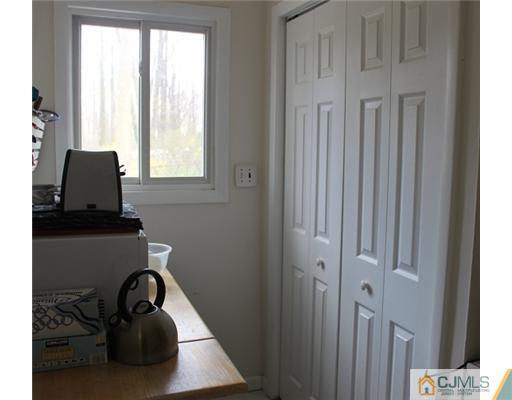 36 Huntington Road Edison, NJ 08820 - Photo 13 of 19 a bathroom with a sink a window and a mirror