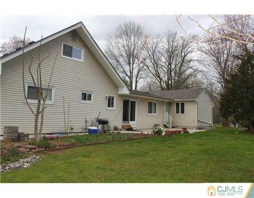 36 Huntington Road Edison, NJ 08820 - Photo 18 of 19 a front view of house with yard and trees
