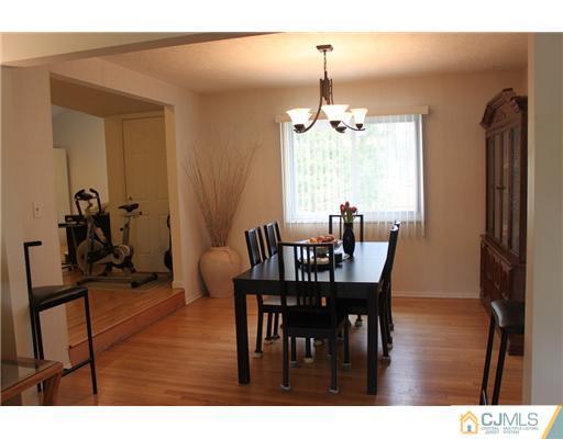 36 Huntington Road Edison, NJ 08820 - Photo 4 of 19 a view of a dining room with furniture window and wooden floor