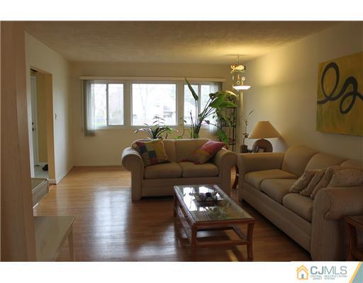 36 Huntington Road Edison, NJ 08820 - Photo 5 of 19 a living room with furniture and a large window