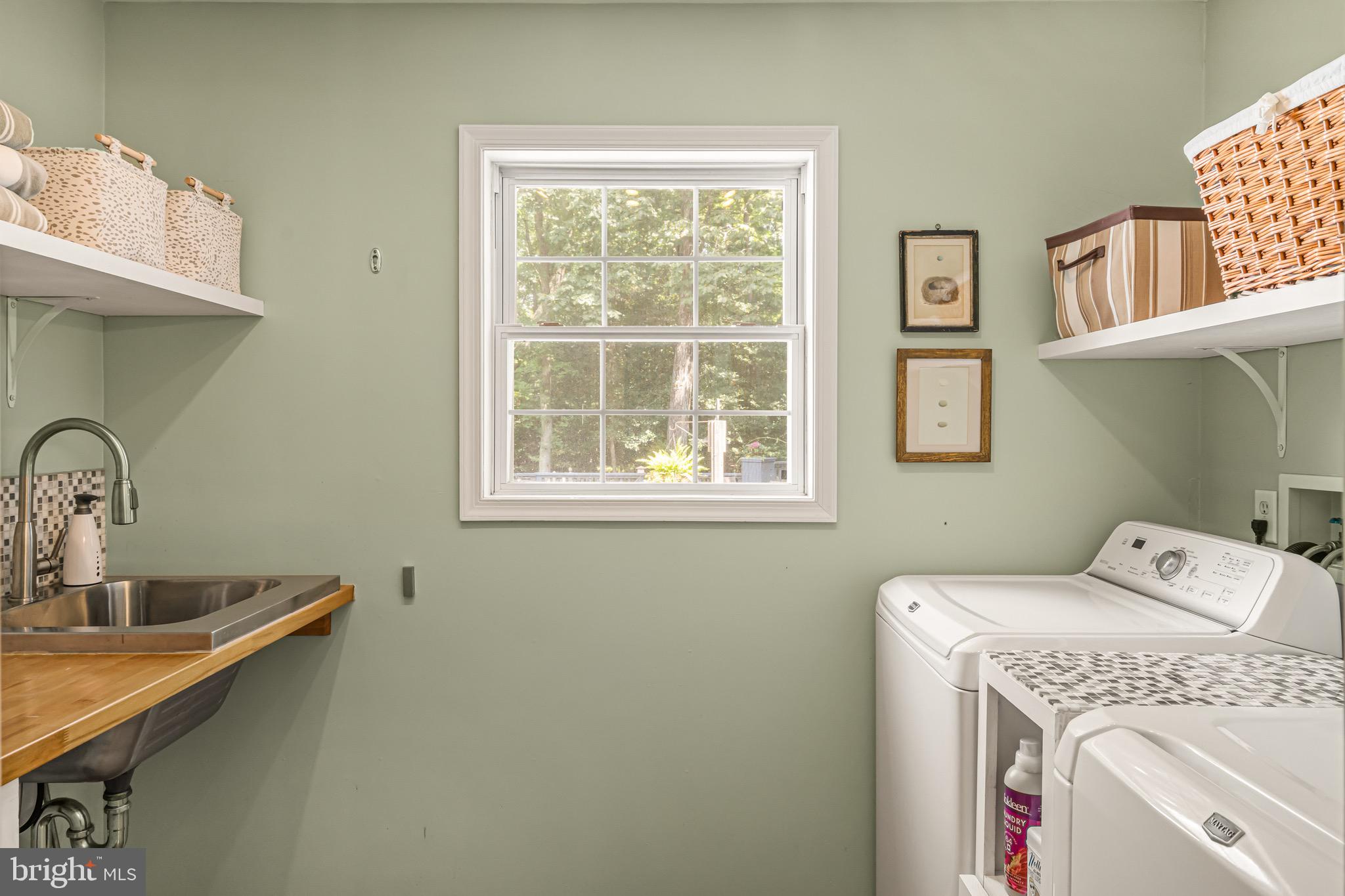 21897 Lavender Lane Lewes, DE 19958 - Photo 24 of 71 And a laundry room with more custom shelving