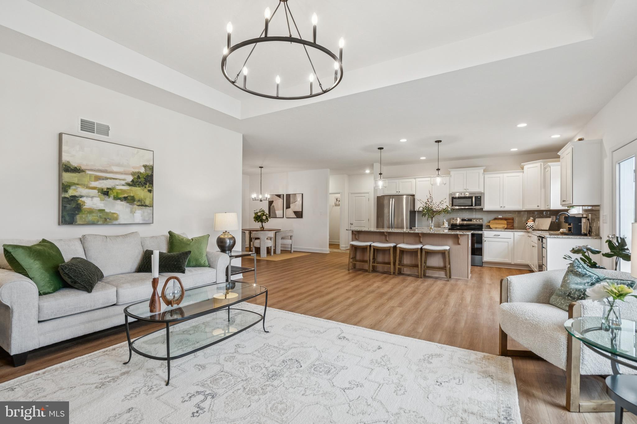 150 Piedmont Way, Unit 101 Hanover, PA 17331 - Photo 21 of 40 a living room with furniture kitchen view and a table
