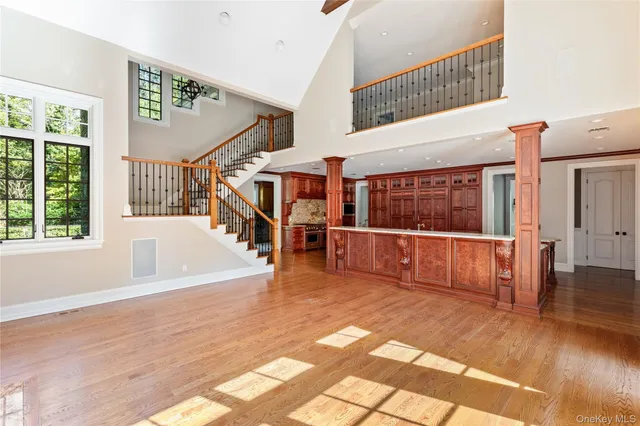 a view of an entryway with wooden floor and door