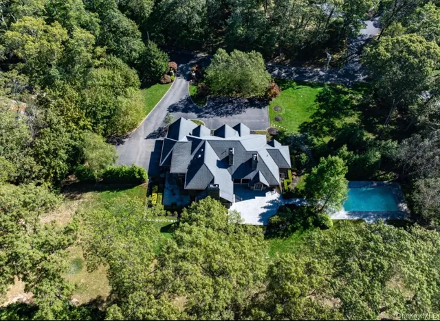 an aerial view of a house with an outdoor space
