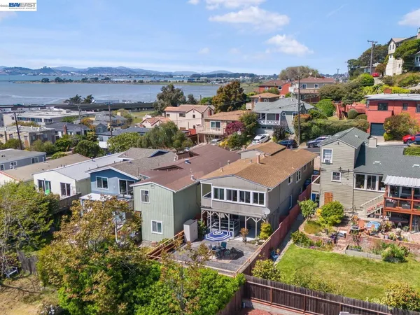 an aerial view of a house with a ocean view