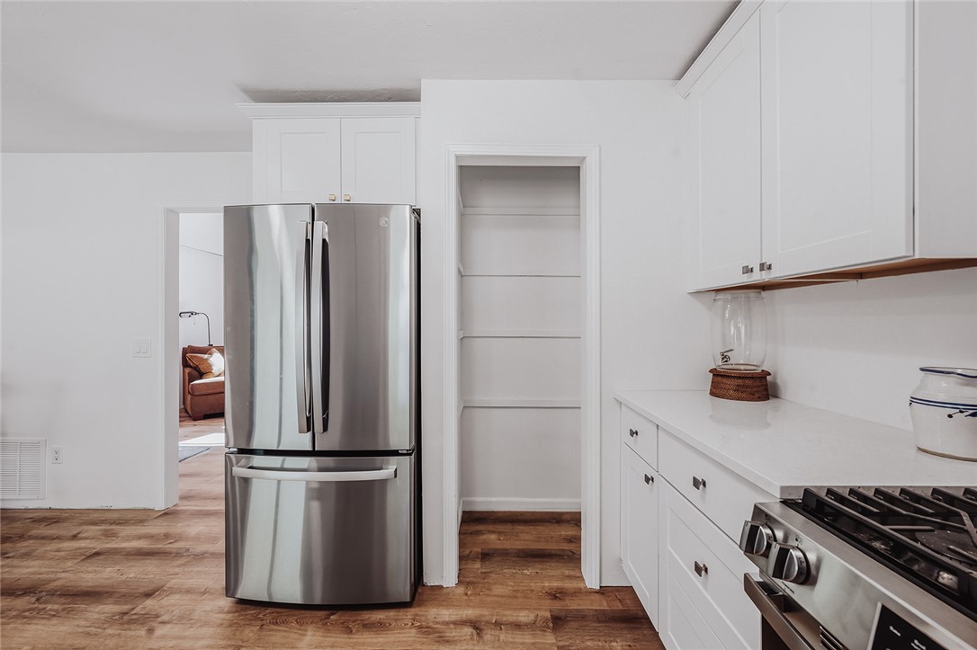 209 Cleveland Pike Road Westminster, SC 29693 - Photo 5 of 30 Modern kitchen with crisp white cabinetry and a spacious pantry for all your culinary needs.