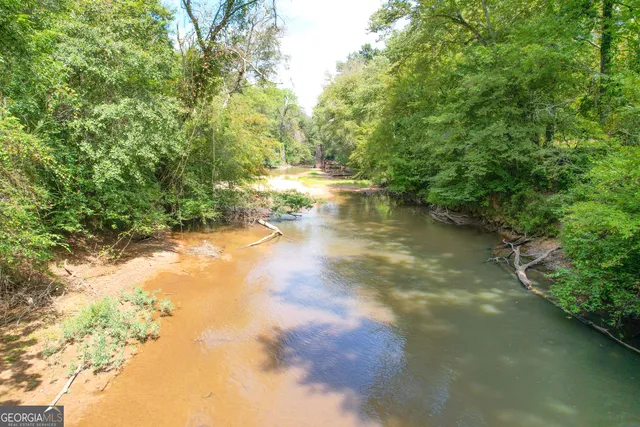 a view of ocean view with large trees