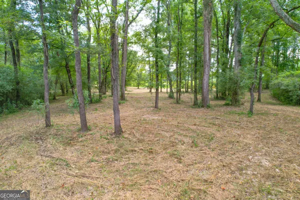 a view of a field with an outdoor space