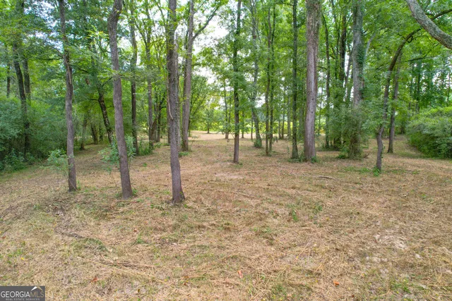 a view of a field with an outdoor space