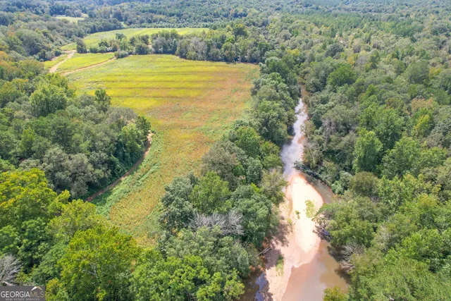 a view of a lake with a yard