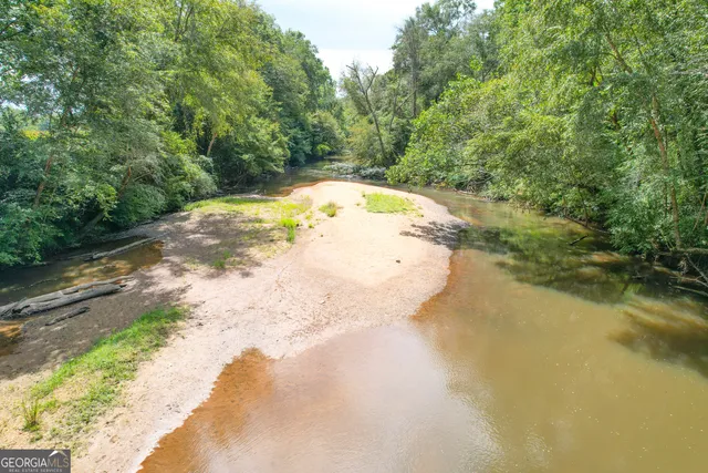a view of a street with a building in the background