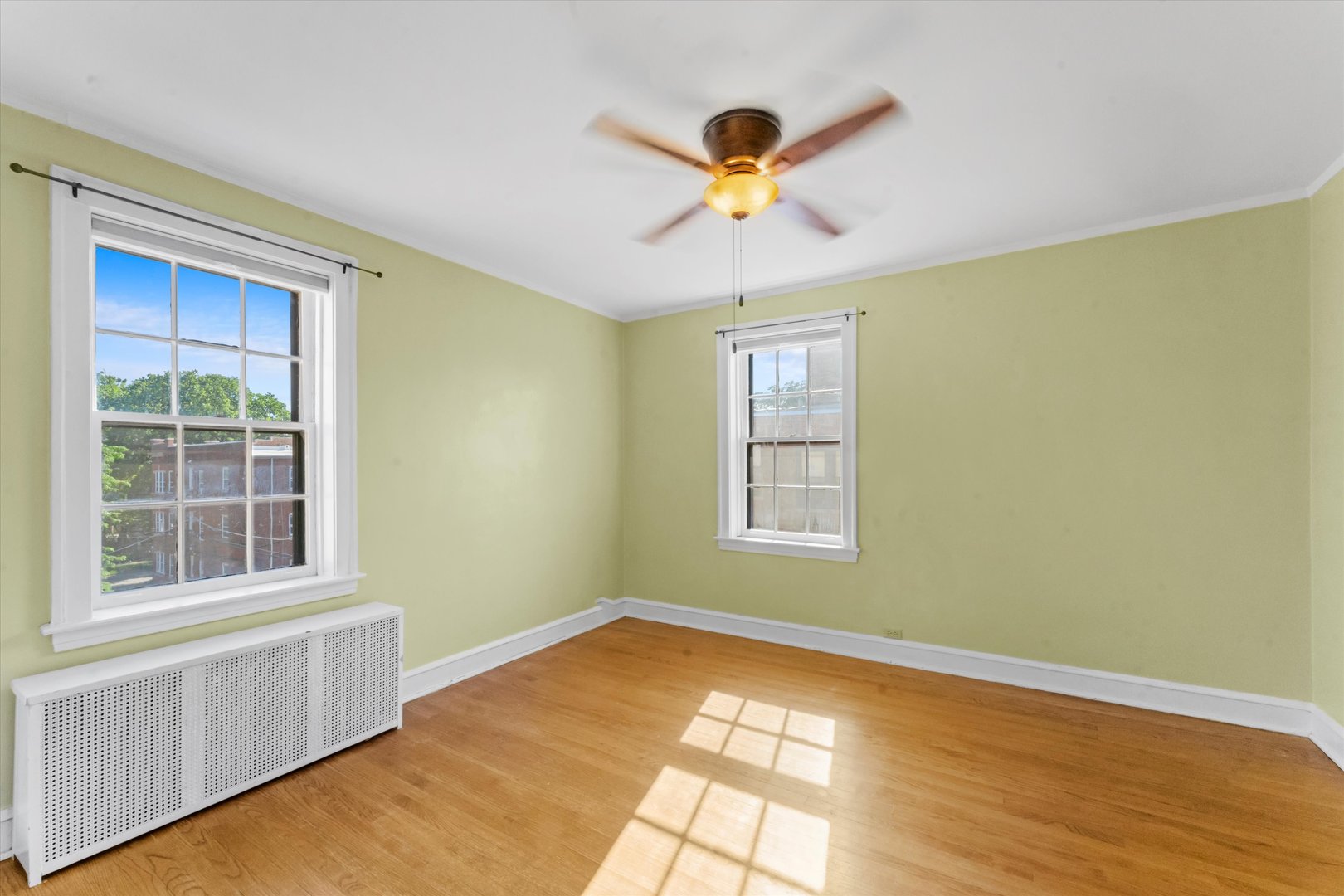1316 Maple Avenue, Unit E3 Evanston, IL 60201 - Photo 14 of 22 a view of an empty room with a window and wooden floor