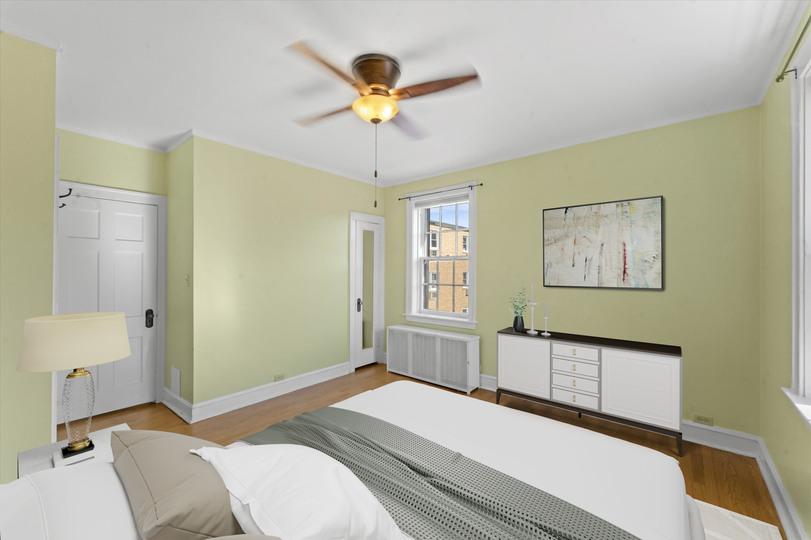 1316 Maple Avenue, Unit E3 Evanston, IL 60201 - Photo 15 of 22 a bedroom with a bed and a chandelier