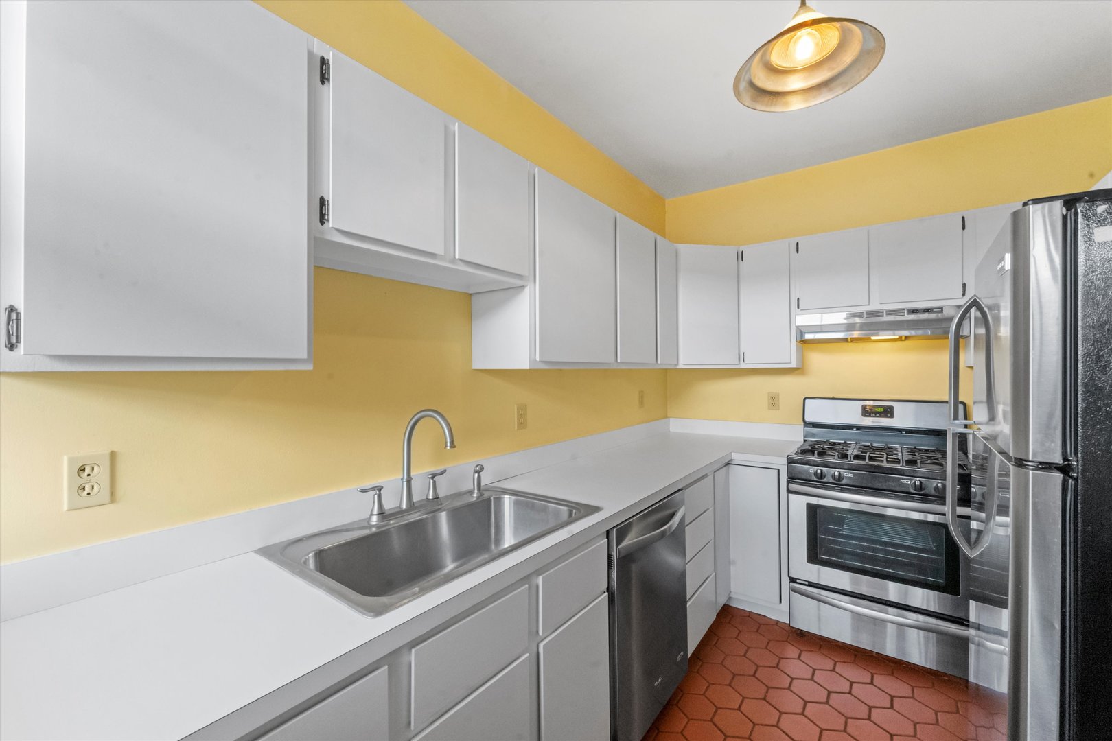 1316 Maple Avenue, Unit E3 Evanston, IL 60201 - Photo 8 of 22 a kitchen with a sink a stove and cabinets