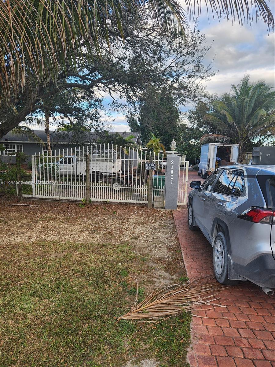 23801 Southwest 217th Avenue Homestead, FL 33031 - Photo 1 of 14 a view of a house with backyard and furniture