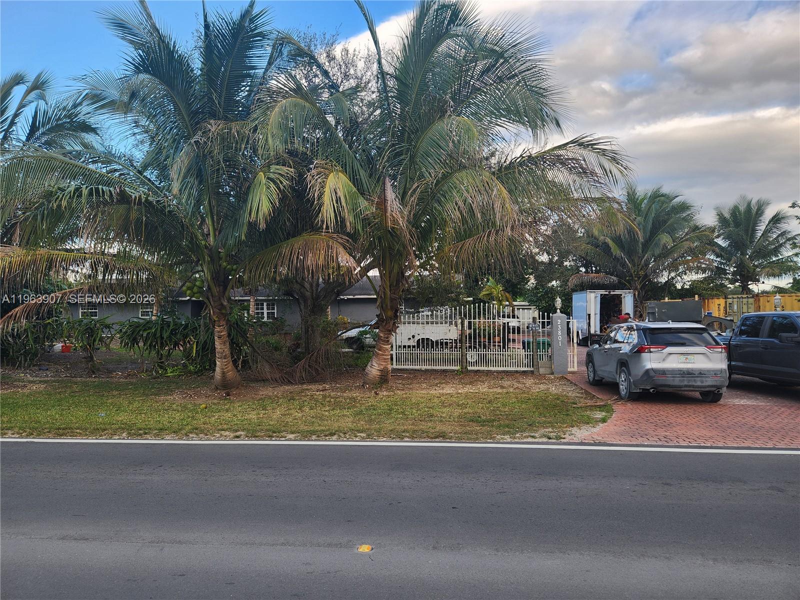 23801 Southwest 217th Avenue Homestead, FL 33031 - Photo 2 of 14 a view of swimming pool with a yard