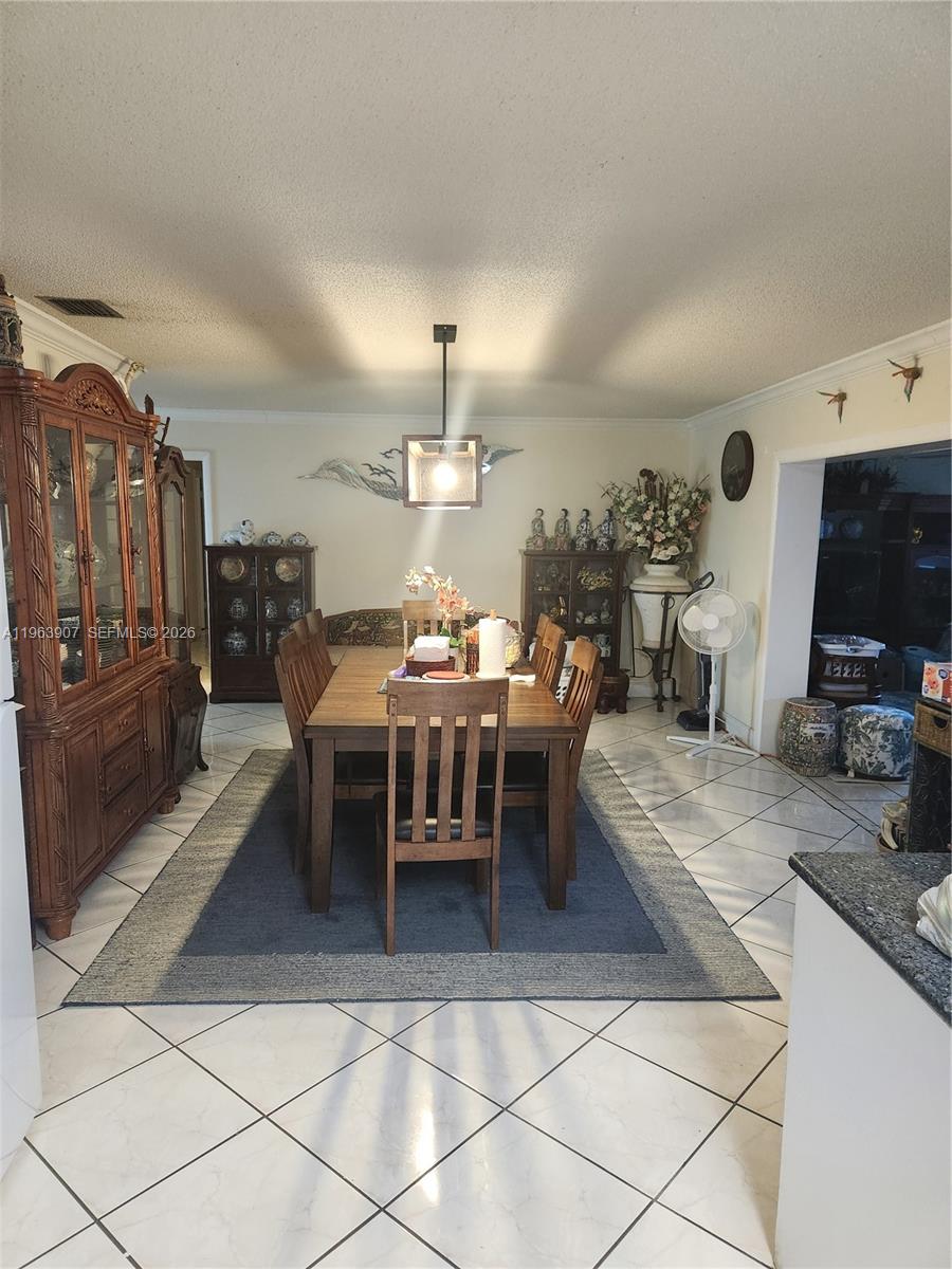 23801 Southwest 217th Avenue Homestead, FL 33031 - Photo 7 of 14 a living room with lots of furniture and kitchen view