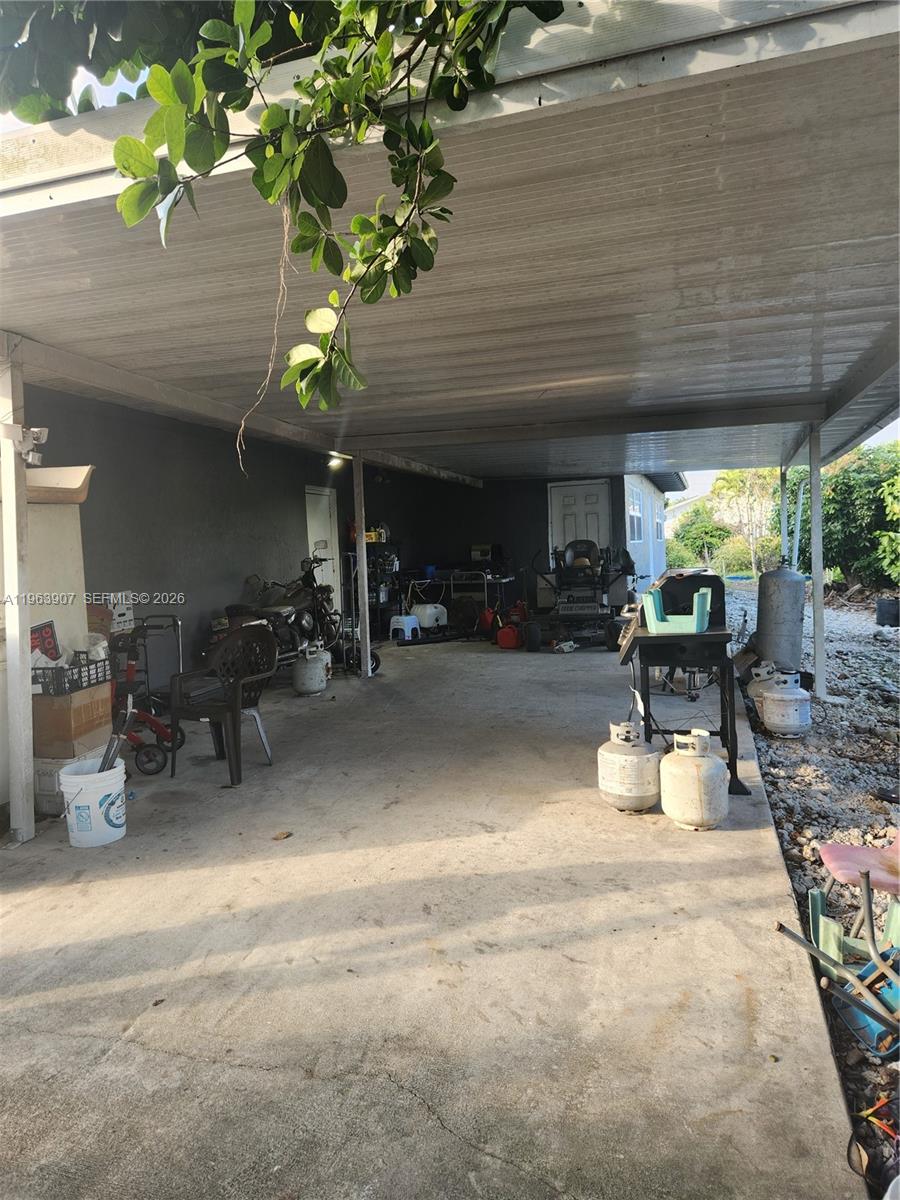 23801 Southwest 217th Avenue Homestead, FL 33031 - Photo 9 of 14 a view of a room with gym equipment