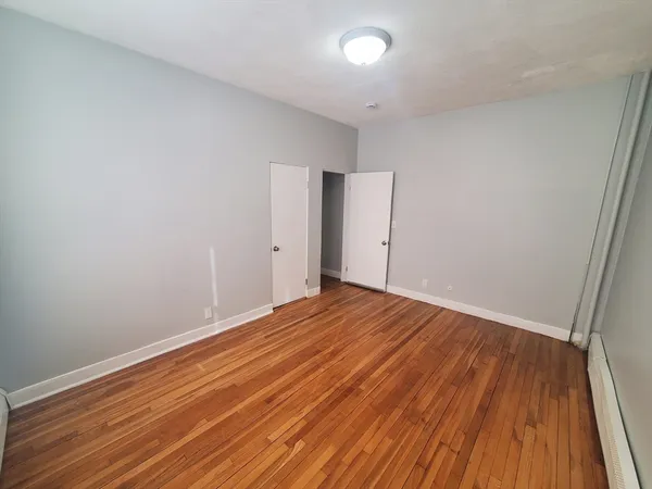 a view of room with wooden floor