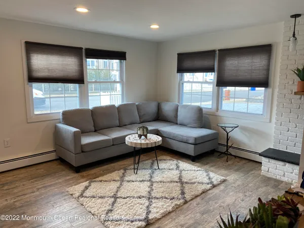 a living room with furniture and windows