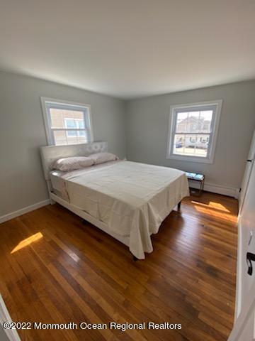 452 Marathon Court Lavallette, NJ 08735 - Photo 9 of 20 a bed sitting in a bedroom next to a window