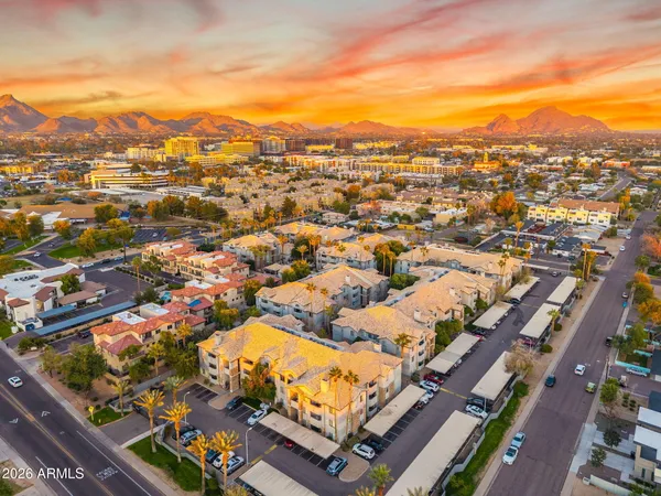an aerial view of residential houses with outdoor space