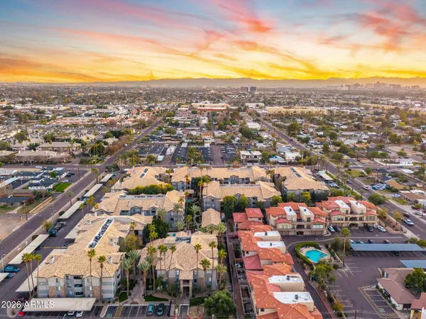 an aerial view of residential houses with outdoor space