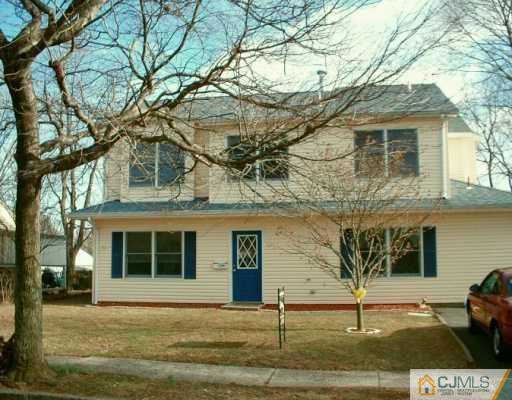 10 Windsor Road Edison, NJ 08817 - Photo 1 of 7 a front view of a house with garden