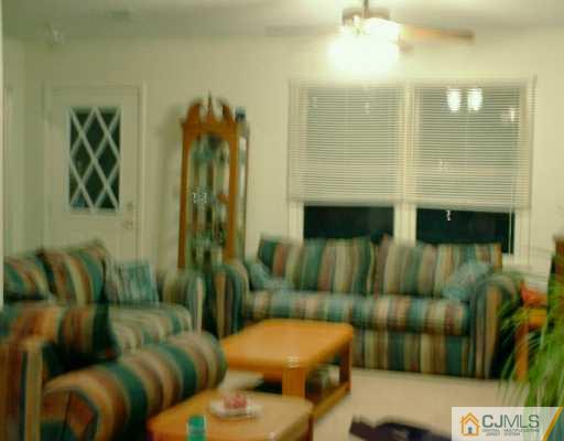 10 Windsor Road Edison, NJ 08817 - Photo 4 of 7 a living room with furniture and a fireplace