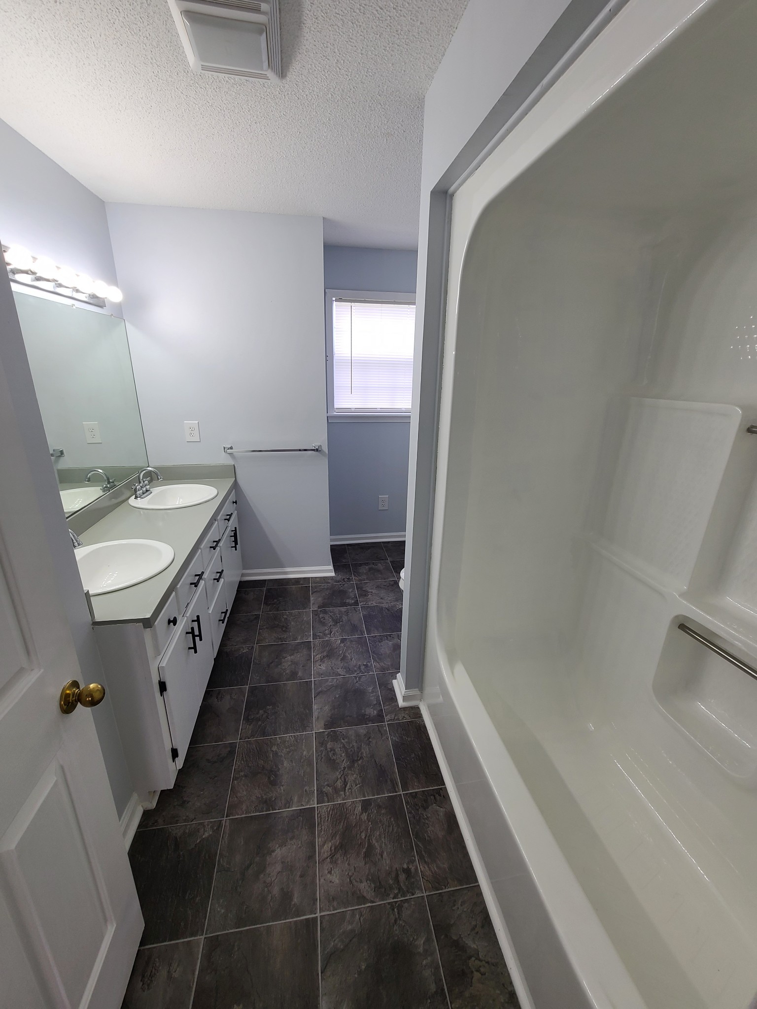 89 Bassham Road Five Points, TN 38457 - Photo 17 of 48 a bathroom with a granite countertop sink toilet and shower