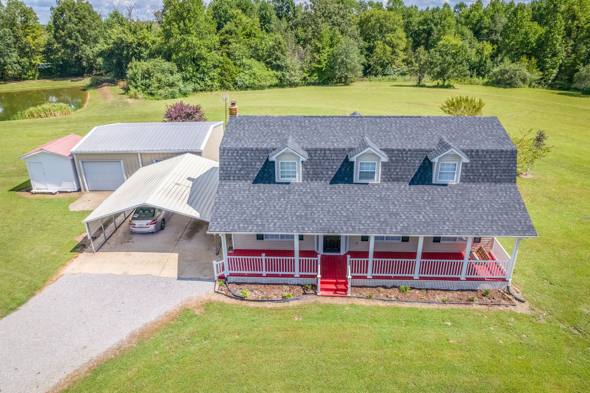 89 Bassham Road Five Points, TN 38457 - Photo 2 of 48 an aerial view of a house with a yard and a fountain