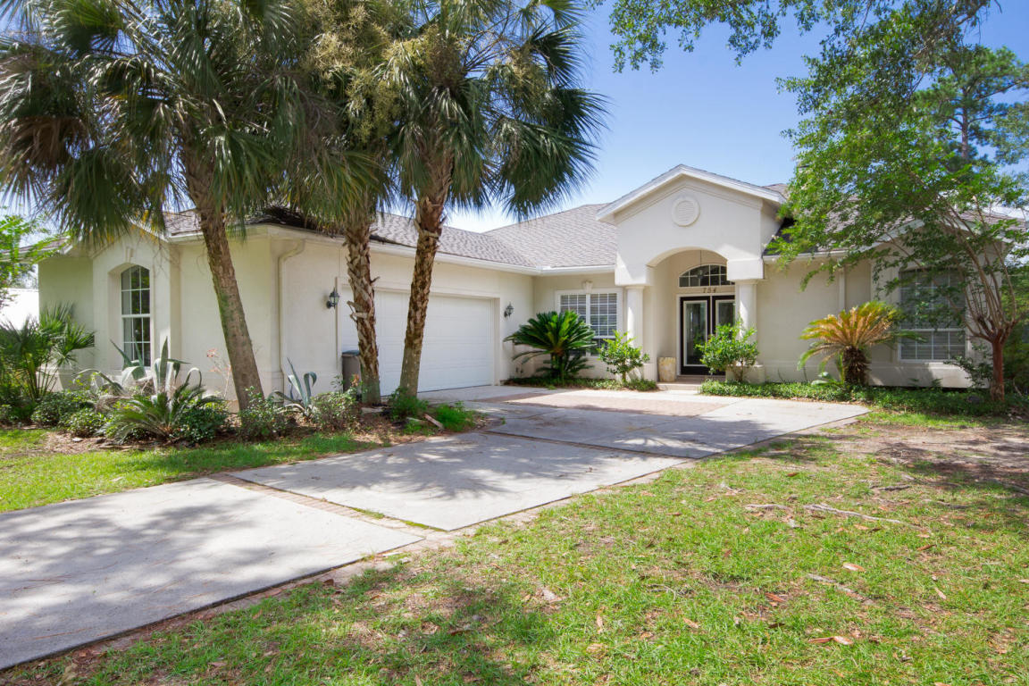 754 Bay Grove Road Freeport, FL 32439 - Photo 1 of 23 a front view of a house with garden